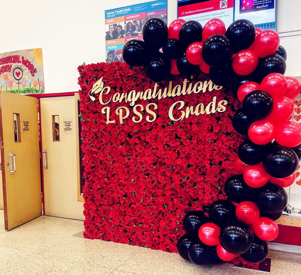 Colourful Red and Black Balloon Decor with Decorative Red Roses Flower Wall Brockville