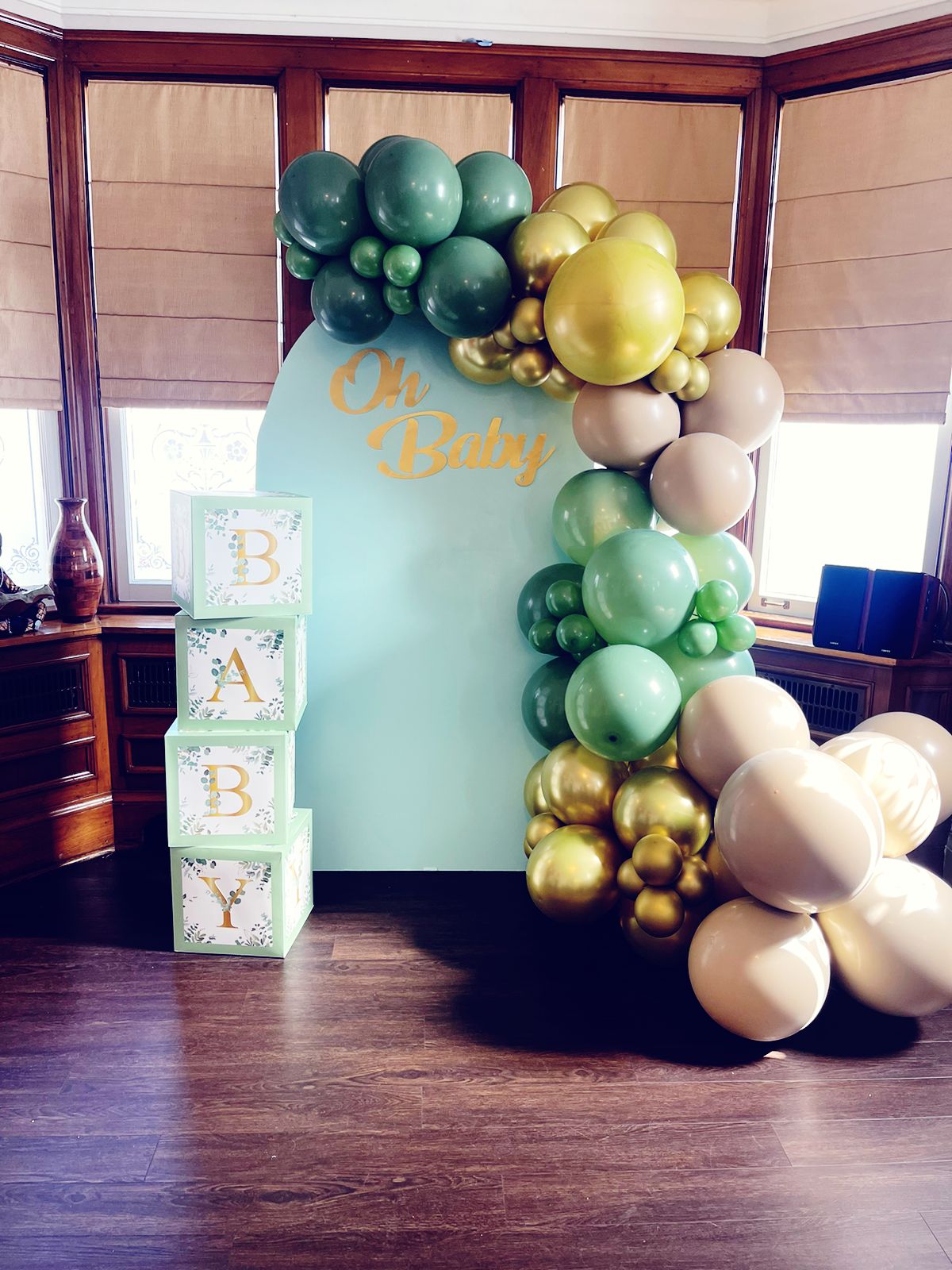 backdrop and balloon decor and letter blocks