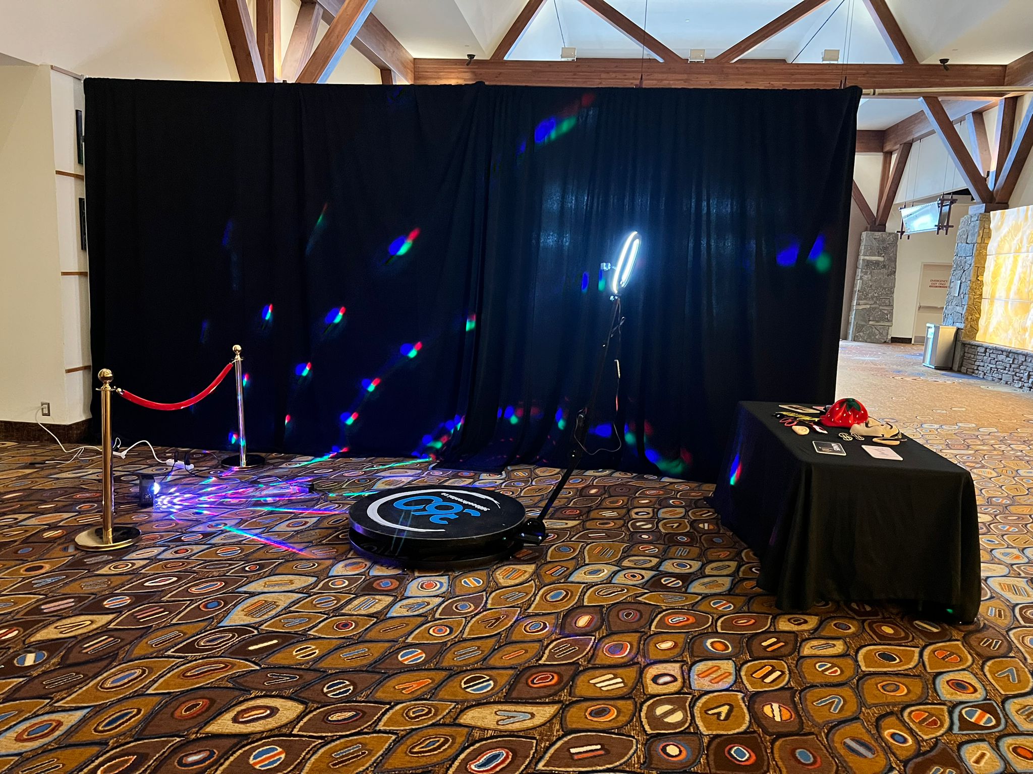 360 video booth with a backdrop and props